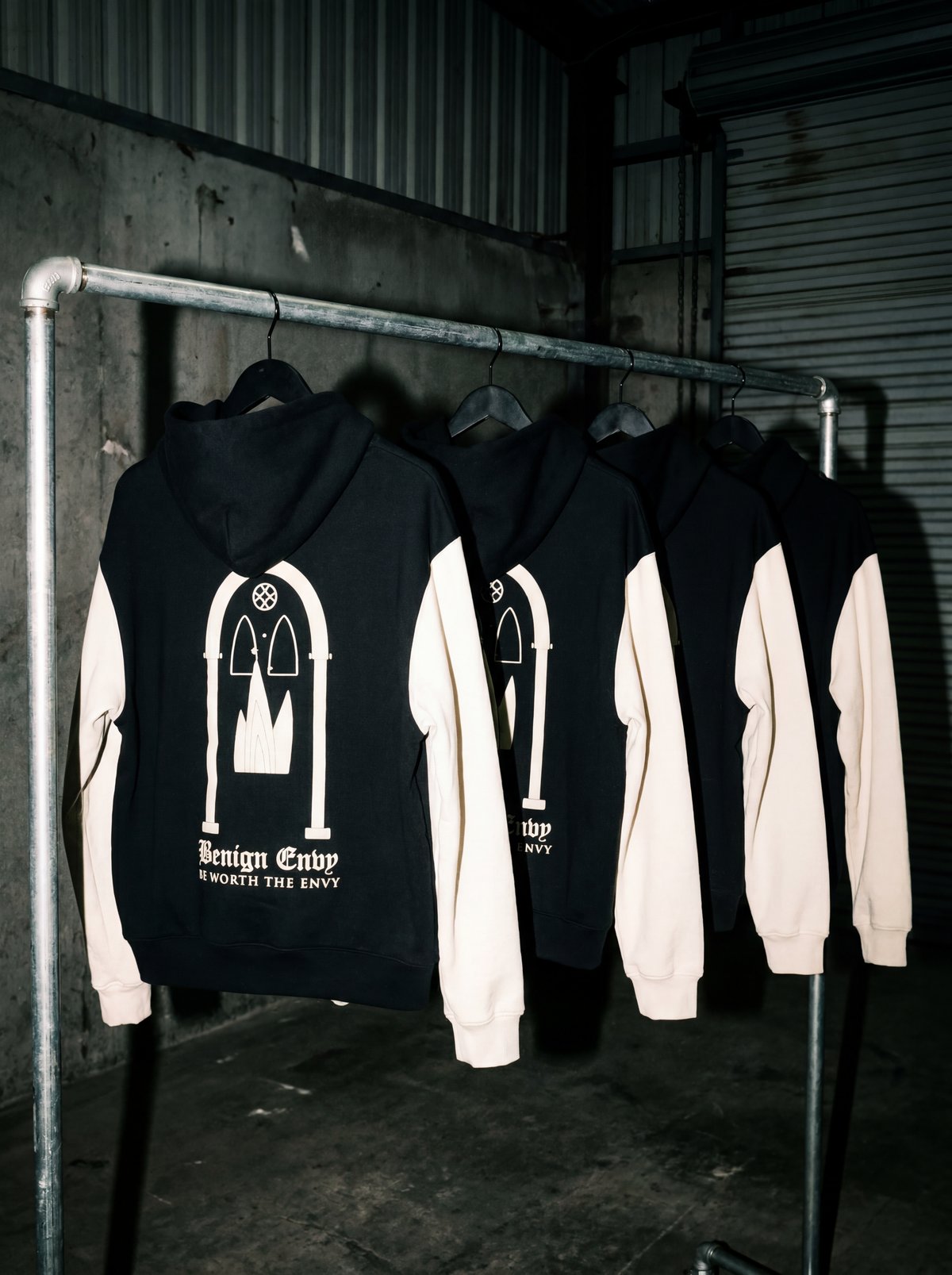 BNVS hoodies on a rack — Benign Envy gothic gate back graphic, Be Worth The Envy